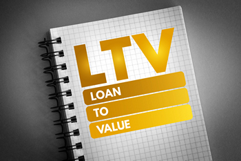 Notebook with the letters “LTV” and the words “loan to value” written below.